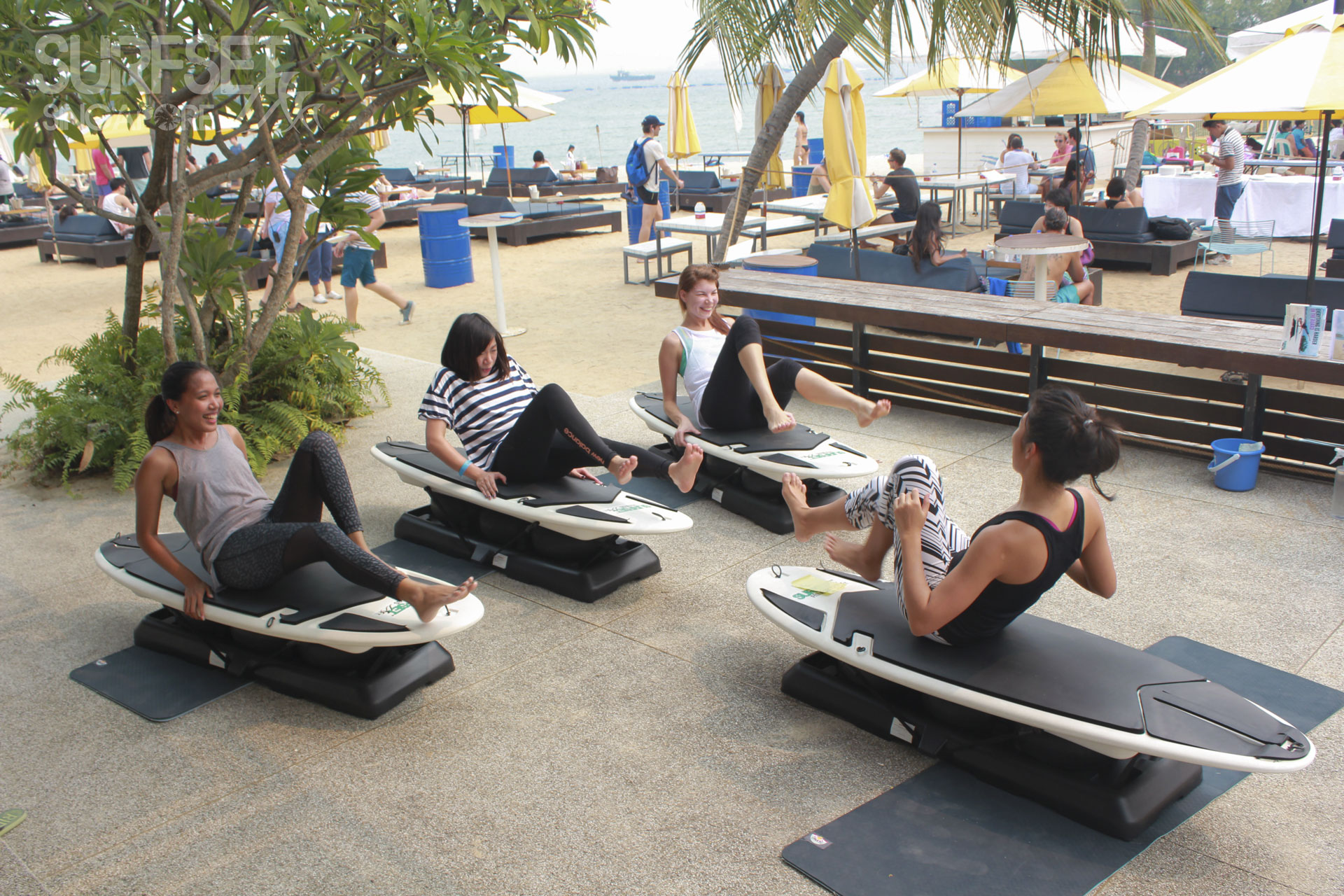 Doing HIIT on Surfset board during Soulscape Yoga Event