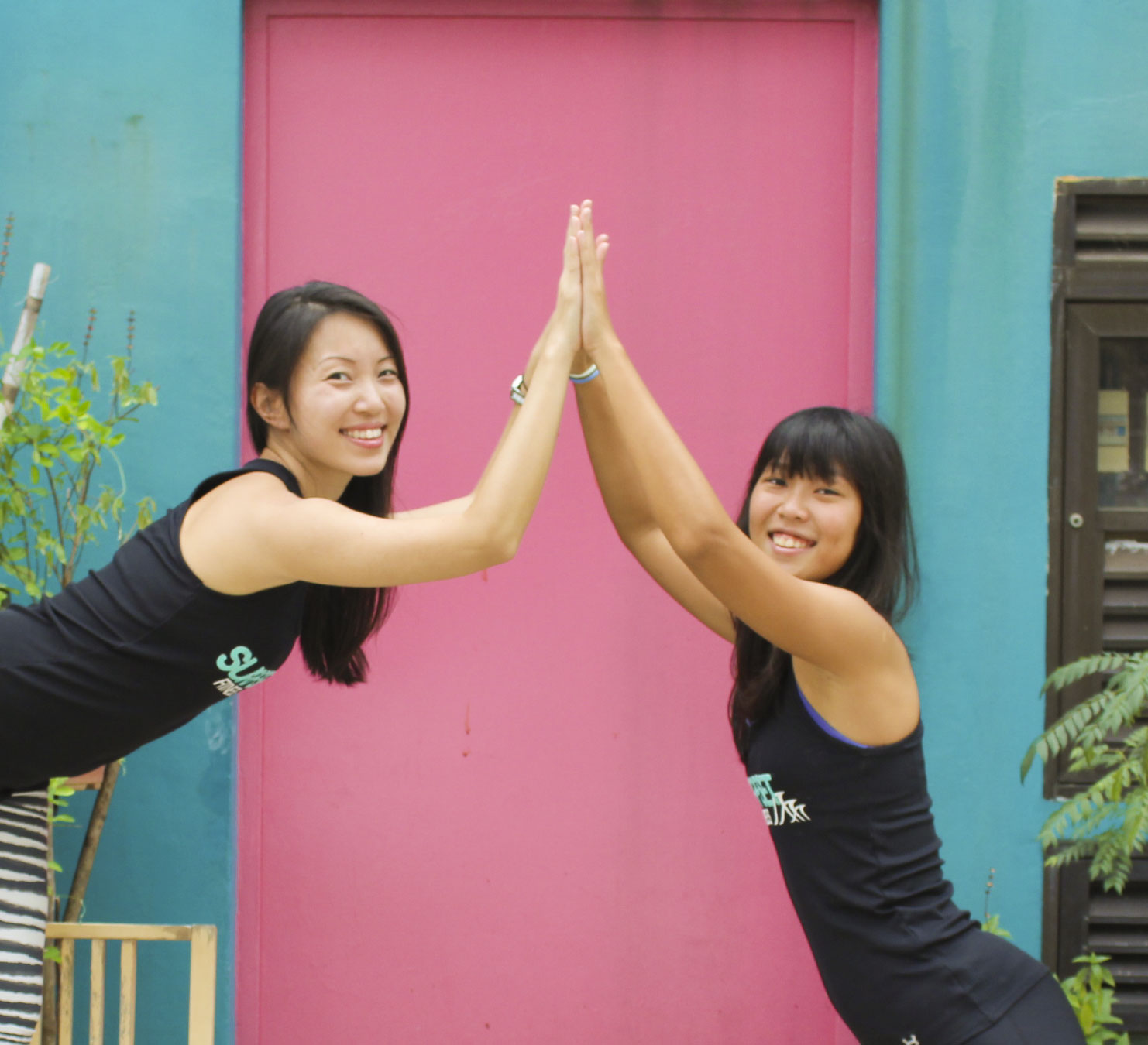 Shuyi and Nat doing Yoga Moves in Katong