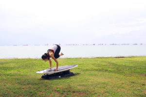 Shuyi Crow Pose on SURFSET board